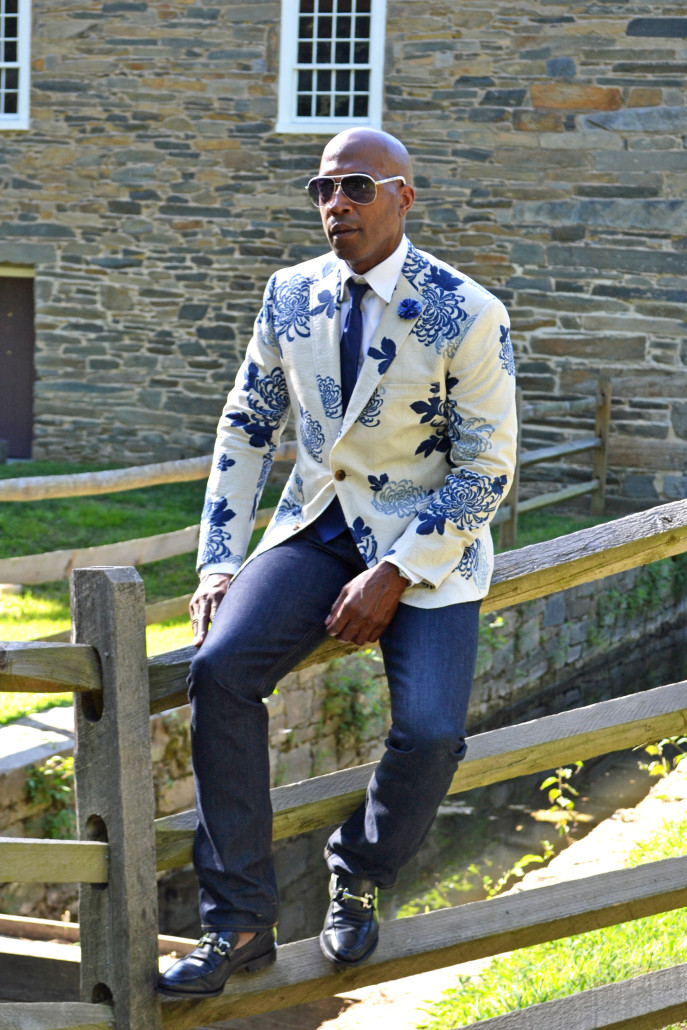 On the fence in a floral blazer