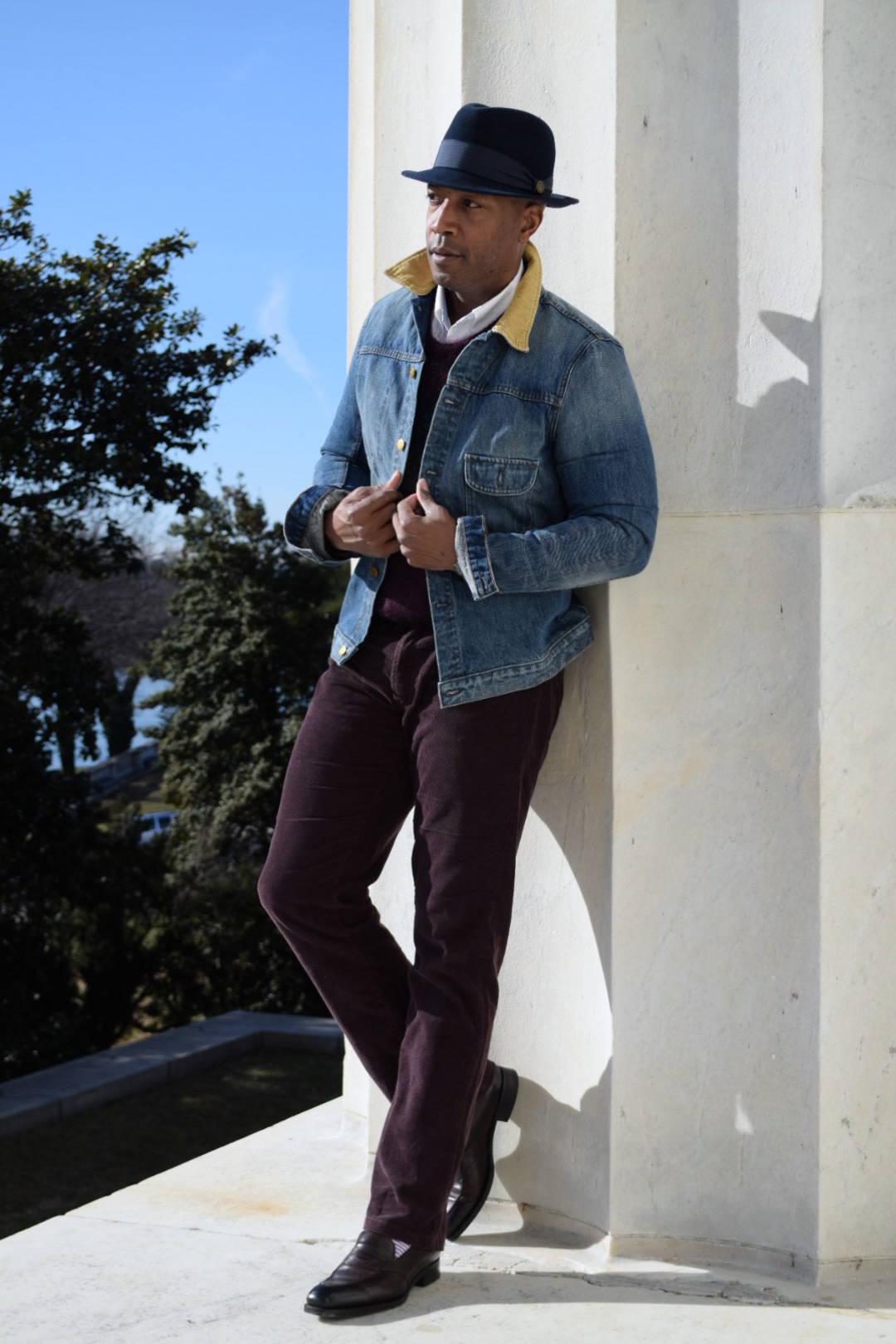 Denim and Corduroy against a pole